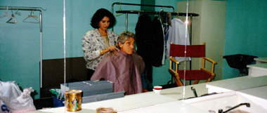 Houston makeup artist Cinthia Moore applies makeup to Maury Povich